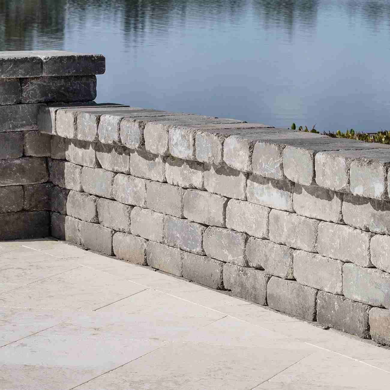 Stacked stone retaining wall along waterfront