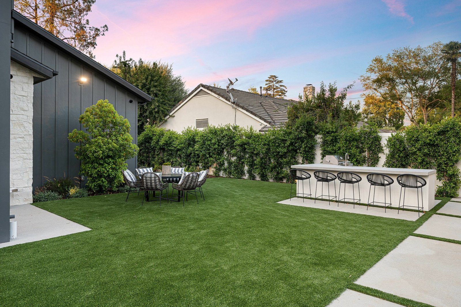 Artificial turf installation with paver border Jacksonville